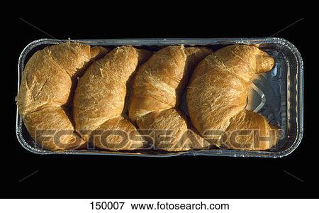 Top view of four croissants in a container View Large Photo Image Stock Photo - Top view of four croissants in a container. Fotosearch