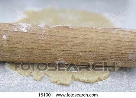 Close up of a rolling pin on dough View Large Photo Image Stock Image - Close up of a rolling pin on dough. Fotosearch
