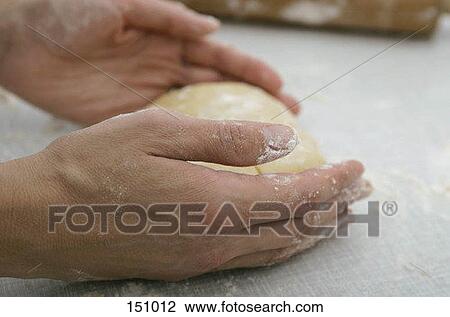 Close up of hands forming dough View Large Photo Image Stock Image - Close up of hands forming dough. Fotosearch