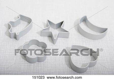 Five metal cookie cutters on a white surface View Large Photo Image Stock Image - Five metal cookie cutters on a white surface. Fotosearch