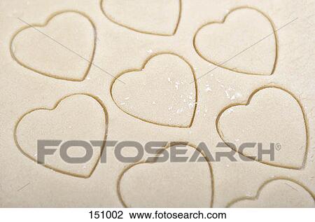 Heart-shaped cookie cutouts View Large Photo Image Stock Image - Heart-shaped cookie cutouts. Fotosearch