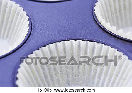 Section of a muffin tray with muffin cups View Large Photo Image Stock Photography - Section of a muffin tray with muffin cups. Fotosearch