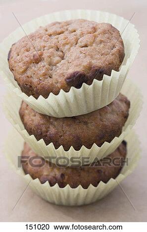 Three muffins stacked View Large Photo Image Stock Image - Three muffins stacked. Fotosearch