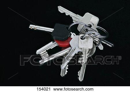 Stock Image - A group of keys on a black surface. Fotosearch