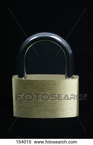 Stock Photography - Front view of a small lock on a black surface. Fotosearch
