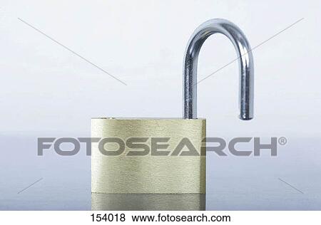 Stock Photo - Front view of a small lock on a shiny surface. Fotosearch