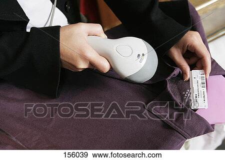 A cashier scanning a barcode View Large Photo Image Stock Photo - A cashier scanning a barcode. Fotosearch