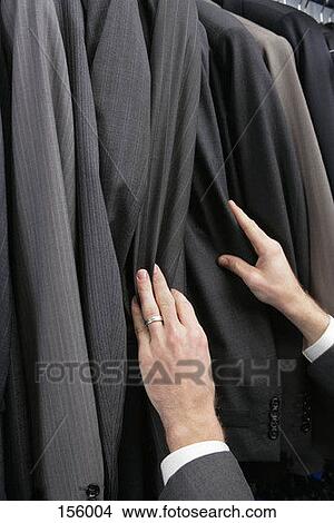A man shopping for a suit View Large Photo Image Picture - A man shopping for a suit. Fotosearch