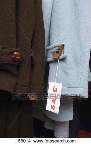 Picture - Close up of a sale tag on a wool coat. Fotosearch