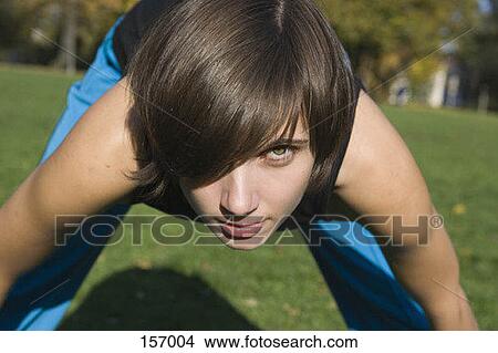 A young woman stretching View Large Photo Image Picture - A young woman stretching. Fotosearch