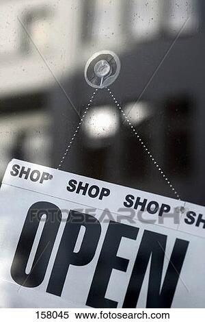 Stock Photography - An open sign hung on a window. Fotosearch