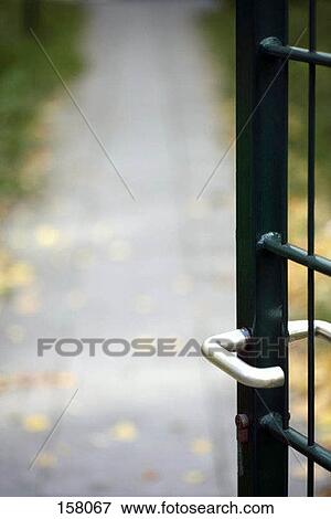 An opened door leading to a path View Large Photo Image Stock Photo - An opened door leading to a path. Fotosearch