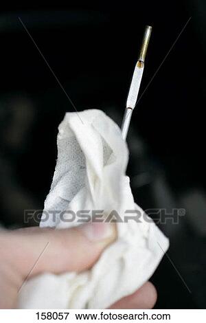 Close up of a thin rod held with tissue paper View Large Photo Image Stock Photo - Close up of a thin rod held with tissue paper. Fotosearch