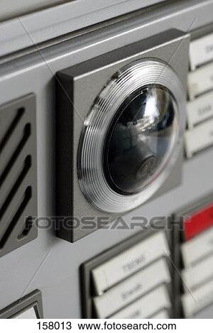 Stock Image - High angle view of an intercom machine consisting of a camera and doorbells. Fotosearch
