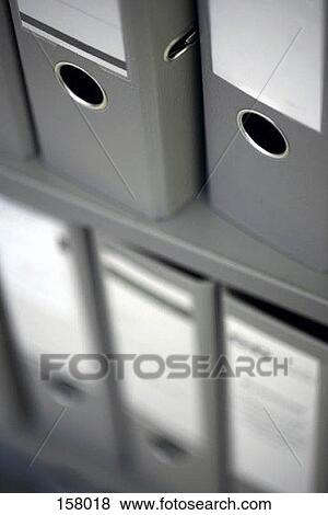 High angle view of grey folders arranged on shelves View Large Photo Image Stock Photo - High angle view of grey folders arranged on shelves. Fotosearch