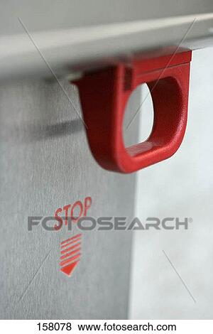 Side view of a red emergency handle View Large Photo Image Stock Photo - Side view of a red emergency handle. Fotosearch