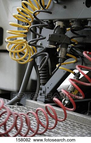 Side view of coiled wires on a piece of machinery View Large Photo Image Stock Image - Side view of coiled wires on a piece of machinery. Fotosearch