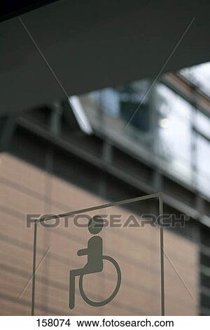The handicap icon on a window View Large Photo Image Picture - The handicap icon on a window. Fotosearch