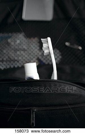 Toothpaste and a toothbrush in a toiletry bag View Large Photo Image Stock Image - Toothpaste and a toothbrush in a toiletry bag. Fotosearch