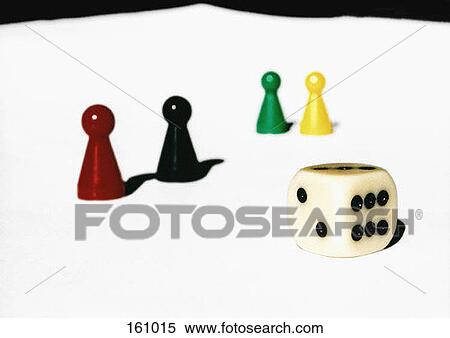 A die with several board game pieces View Large Photo Image Stock Photography - A die with several board game pieces. Fotosearch