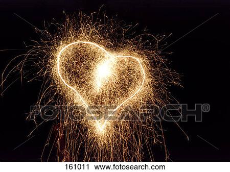 A sparkler in the shape of a heart View Large Photo Image Stock Image - A sparkler in the shape of a heart. Fotosearch