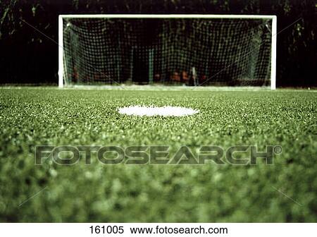 View of a goalpost on a soccer field at night View Large Photo Image Stock Photography - View of a goalpost on a soccer field at night. Fotosearch