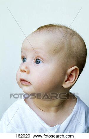 Stock Image - Portrait of a baby with blue eyes. Fotosearch