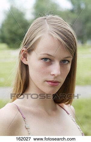Portrait of a young girl View Large Photo Image Stock Photo - Portrait of a young girl. Fotosearch