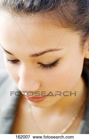 Portrait of a young woman View Large Photo Image Stock Photo - Portrait of a young woman. Fotosearch