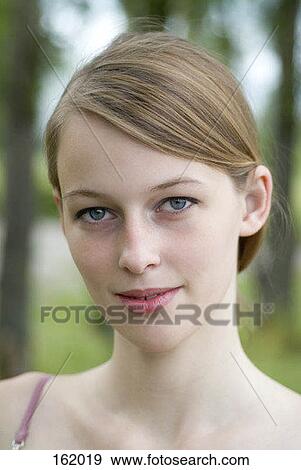 Portrait of a young woman View Large Photo Image Stock Photo - Portrait of a young woman. Fotosearch