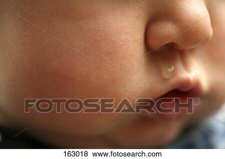 Mucus coming out of a baby's nose View Large Photo Image Stock Photo - Mucus coming out of a baby's nose. Fotosearch