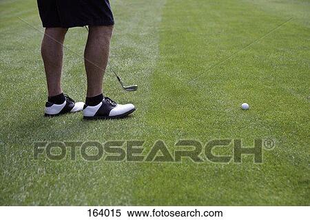 High angle view of a golfer's legs on a fairway View Large Photo Image Stock Photography - High angle view of a golfer's legs on a fairway. Fotosearch