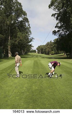 Two golfers on a tee box View Large Photo Image Stock Image - Two golfers on a tee box. Fotosearch