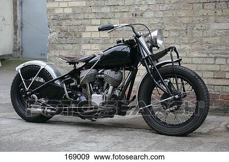 Side view of an antique motorcycle View Large Photo Image Stock Photo - Side view of an antique motorcycle. Fotosearch