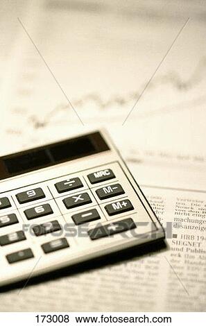 A calculator on a newspaper View Large Photo Image Stock Photo - A calculator on a newspaper. Fotosearch