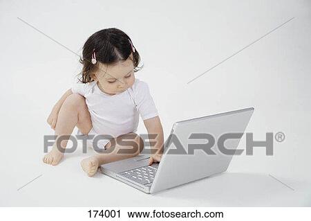 A baby typing on a laptop View Large Photo Image Stock Image - A baby typing on a laptop. Fotosearch