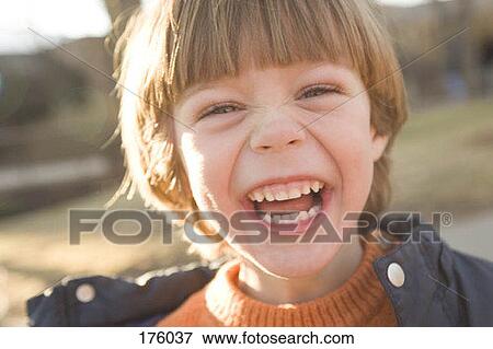Stock Photo - A young boy laughing. Fotosearch