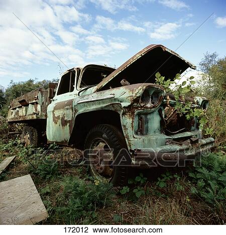 Stock Image - Abandoned pick-up truck in field. Fotosearch