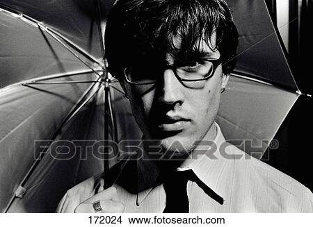 Man holding umbrella View Large Photo Image Picture - Man holding umbrella. Fotosearch