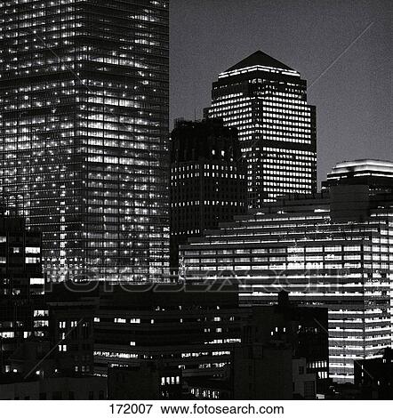 View of city buildings at night, Manhattan, New York City View Large Photo Image Stock Photo - View of city buildings at night, Manhattan, New York City. Fotosearch