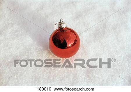 Close-up of red Christmas decoration in snow View Large Photo Image Stock Image - Close-up of red Christmas decoration in snow. Fotosearch