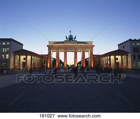 Stock Photo - Brandenburg Gate illuminated with orange light. Fotosearch