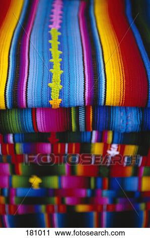 Pile of folded striped Mayan shawls, Guatemala View Large Photo Image Stock Image - Pile of folded striped Mayan shawls, Guatemala. Fotosearch