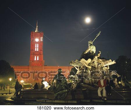 Stock Image - Town Hall illuminated with red light, Berlin, Germany. Fotosearch