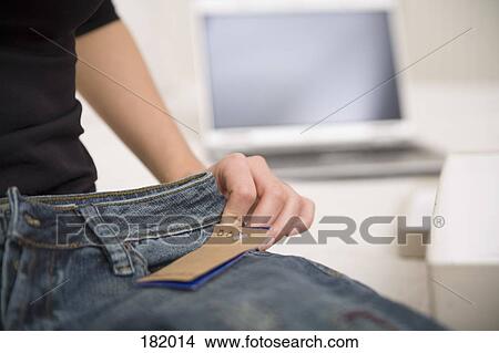 Close-up of young woman holding new jeans View Large Photo Image Picture - Close-up of young woman holding new jeans. Fotosearch