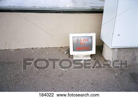 Stock Image - Abandoned computer screen on sidewalk with message. Fotosearch