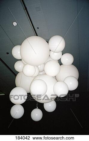 Bunch of white balloons hanging from ceiling View Large Photo Image Stock Image - Bunch of white balloons hanging from ceiling. Fotosearch