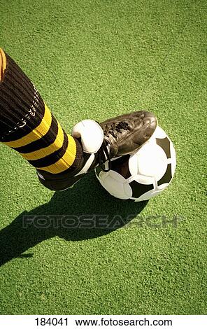 Soccer player balancing foot on top of ball View Large Photo Image Stock Image - Soccer player balancing foot on top of ball. Fotosearch