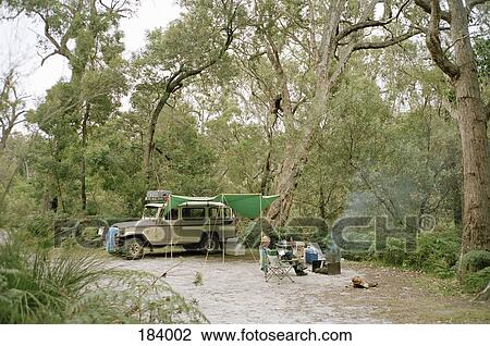 Woman sitting at camp site View Large Photo Image Stock Image - Woman sitting at camp site. Fotosearch
