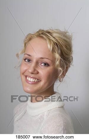 Young woman smiling with curly blond hair View Large Photo Image Stock Photo - Young woman smiling with curly blond hair. Fotosearch